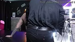 Gabe Spec shows points to spank woman's ass in sheer red