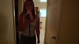 April Aniston receives cum on her tits in this intriguing scene.