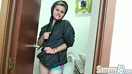 Sammy 18 displays natural tits while fingering her pussy