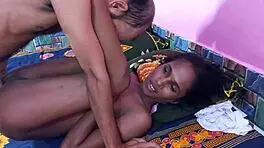 Two guys fuck a black whore in doggystyle while she sucks their cocks