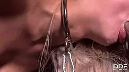 Submissive blondie Lara Onyx gets double penetrated in chains.