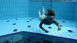 look at clara's small tits underwater in the pool