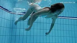 look at clara's small tits underwater in the pool