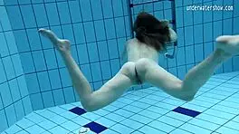 look at clara's small tits underwater in the pool