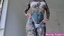 Melody Radford rocks a sheer micro bikini in a hot backstage try-on haul. Her huge tattooed curves steal the show!