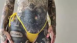 Melody Radford rocks a sheer micro bikini in a hot backstage try-on haul. Her huge tattooed curves steal the show!