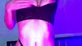 A young blonde jerks off with a rubber dildo before bed, intensely