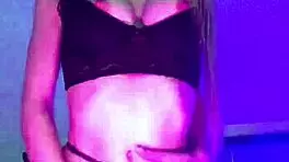 A young blonde jerks off with a rubber dildo before bed, intensely