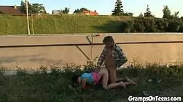 Teen enjoys outdoor adventure as traffic passes by