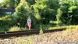 Teen enjoys outdoor adventure as traffic passes by