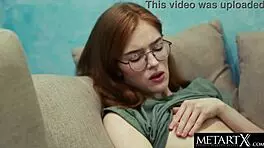 Watch this sexy natural redhead in glasses take a steamy study break to play.