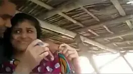 Two couples relax in hut