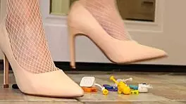 Wife in heels crushes toys with her big ass and small tits exposed.