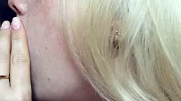 wife gives close-up attention to friend under romantic lights