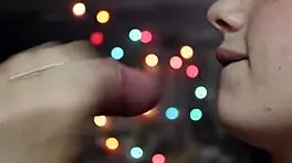 wife gives close-up attention to friend under romantic lights