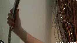 Solo beauty teases with fingers on her wet pussy lips