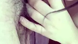 girlfriend on the balcony teases by playing with her wet pussy