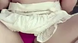 girlfriend on the balcony teases by playing with her wet pussy