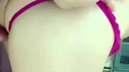 girlfriend on the balcony teases by playing with her wet pussy