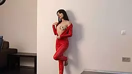 Bold Brunette In Red Latex Shows Off Her Shaved Young Pussy