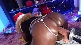 Hey, check out this ebony babe on the fuck machine with BBC dildo, she's moaning so loud!