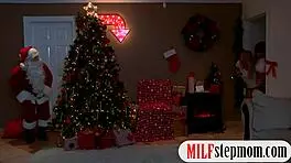 Milf and teen share a moment with Santa.