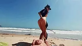 i'm a teen girl masturbatin' on the nude beach, caressin' my feet while he jerks off and cums