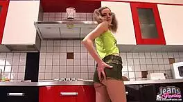 A Skinny Brunette Teen Shows Her Panties Peeking Out of Tight Jeans