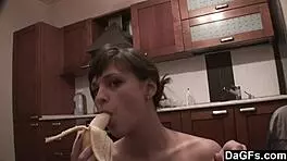 Dagfs - freckled-face babe plays with her dildo on kitchen counter, ripping clothes and exposing small 18+ tits and shaved pussy.