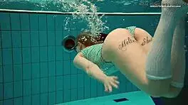 Dasha Explores Underwater Depths At The Beach