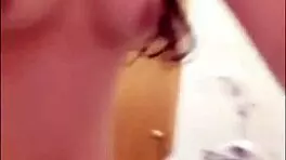 Chinese teen plays with tits