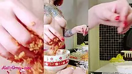 busty girl teasing and oiling her body in the kitchen