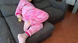 The cute babe sucks her boyfriend's friend on the sofa while he plays GTA