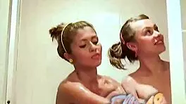 Why is Ellie 18 rubbing pussy with her lesbian friend in the shower?