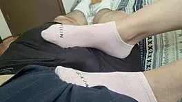 Shy teen teases friend's cock with toes, delivers footjob to cumshot!