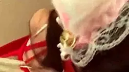 Stunning teen brunette in a tightCORSET:], wearing bondage restraints and cat ears costume performs a fake blowjob