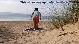 i filmed a curvy milf changing clothes and exercising naked on the beach