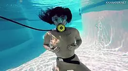 Brita piskova pleasures herself underwater in the pool, showing tits and ass