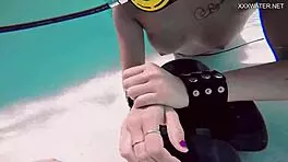 Brita piskova pleasures herself underwater in the pool, showing tits and ass