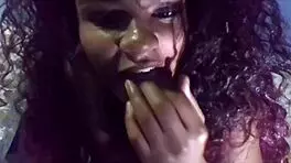 This sweet black curly girl fingers her wet pussy solo.