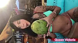 Queen Victoria is at the beach in her bikini, casually riding a dildo in the shower