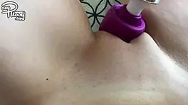 Point-of-view selfie of a teen girlfriend masturbating with a vibrator on her shaved pussy