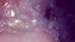 Sexy milf aggressively fucks her young boyfriend in the hot tub, showing off her big tits and ass.