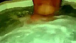 Sexy milf aggressively fucks her young boyfriend in the hot tub, showing off her big tits and ass.