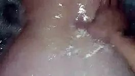 Sexy milf aggressively fucks her young boyfriend in the hot tub, showing off her big tits and ass.