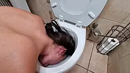 Dirty Whore Pisses and Licks Inside Filthy Toilet Bowl