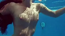 kittina ivory undresses in the swimming pool