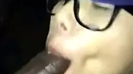 Teen gives detailed blowjob to black cock ending in cumshot