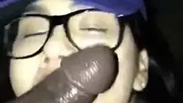 Teen gives detailed blowjob to black cock ending in cumshot