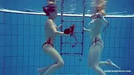 Marusia and melisa darkova bathe in bikini underwater.